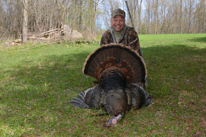 Bob Peterson of Marinette with a tom turkey harvested in Shawano County. - Photo credit: DNR