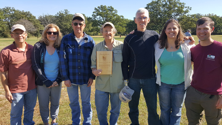 DNR's Jared Urban and Sharon Fandel, far right, presented the Volunteer Steward of the Year Award to members of the Chiwaukee Prairie Preservation Fund including, left to right: Chad Heinzelman, Amy Duhling, Alan Eppers, Pam Holy and Nathan Robertson. 