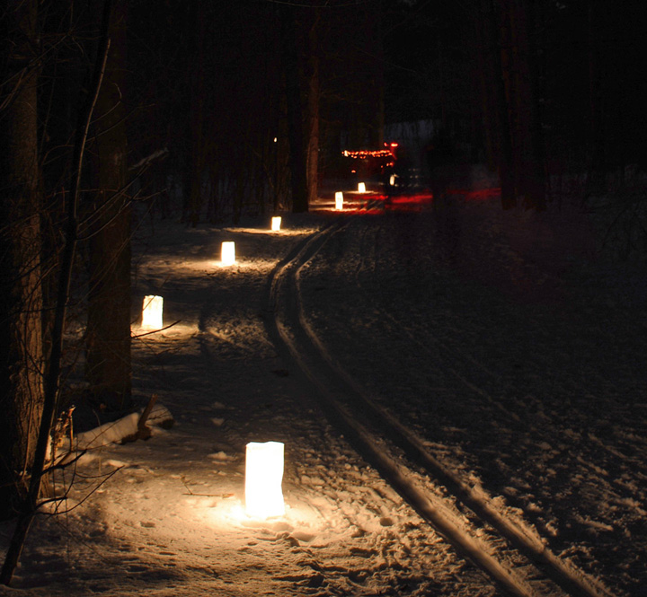 Hundreds of luminaries are placed out along trails for candlelight events.  These are in ice buckets at the Southern Unit of the Kettle Moraine. - Photo Credit: DNR by Ed Culhane
